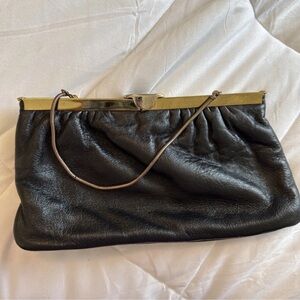 Chic Black Leather Wristlet with Gold Accents